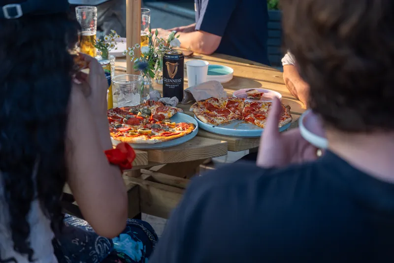 Pizza on a table at Apex Lounge